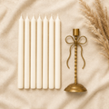 Ivory dinner candles on cream linen