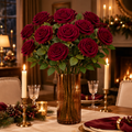 Red velvet long stem roses in amber glass vase on festive dining table